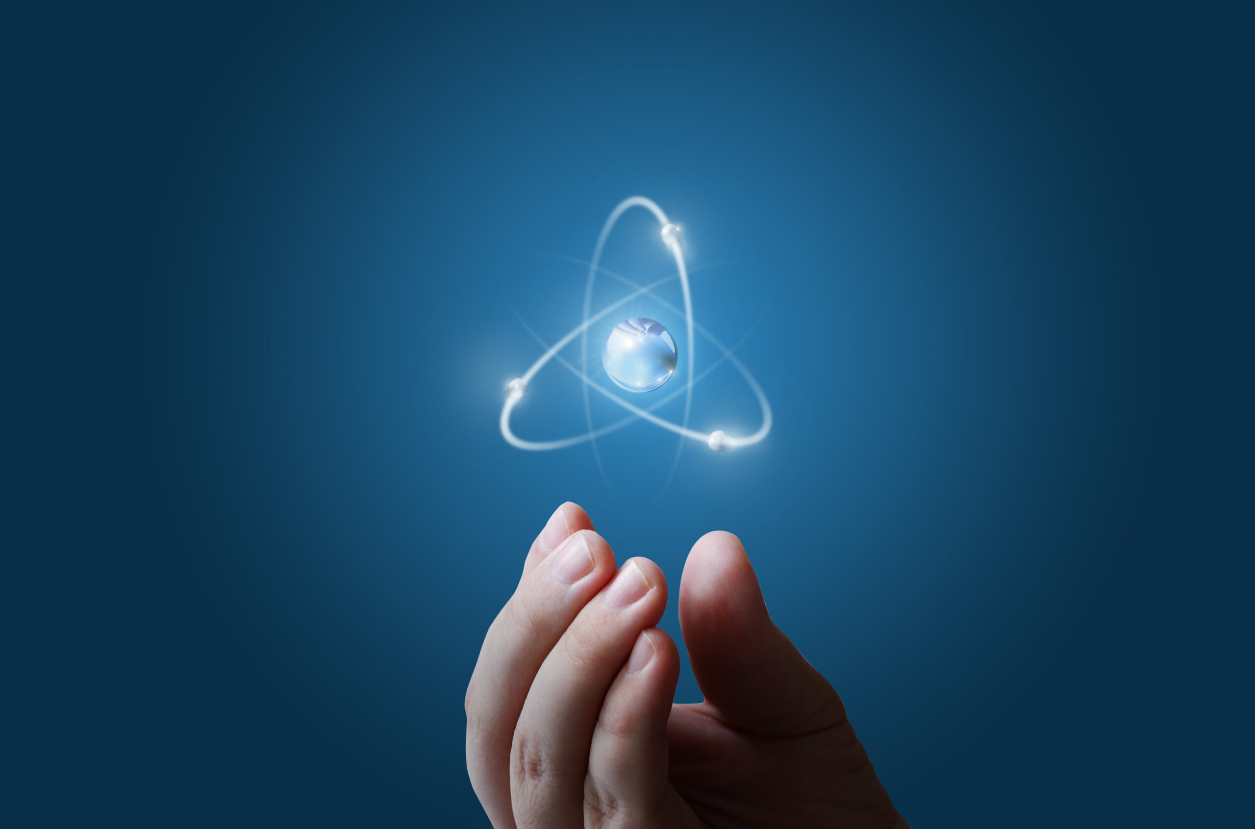 Atoms flying along the orbit in the hand.